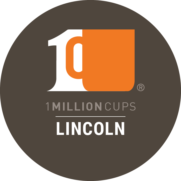 1 Million Cups Lincoln the number one and and orange coffee cup on a brown background.